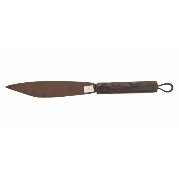 A brown dagger with a wooden handle facing left. There are marks on the handle and there is a metal loop on the end. 