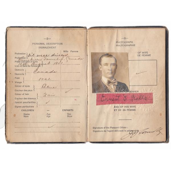 Pages two and three of passport belonging to Ernest Kells, giving a personal description. It includes his photograph and signature.