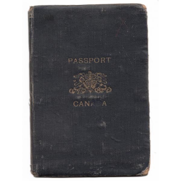Cover of Canadian Passport belonging to Ernest Kells. The passport is black and there is a gold crest on the front as well as the words "PASSPORT" and "CANADA".  