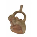 Front side of red and cream coloured stirrup-spout bottle in the shape of a crouched monkey. 