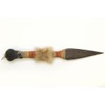 Front view of the toy wooden knife with orange, green and natural coloured hemp decoration.