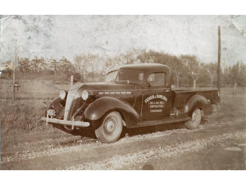 Old truck marked "Stover and Rawlings" on the side